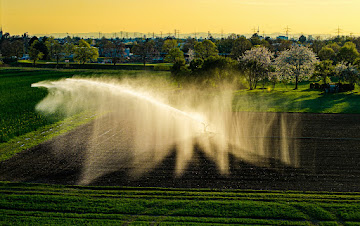 Integration of sprinkler systems with agricultural technology